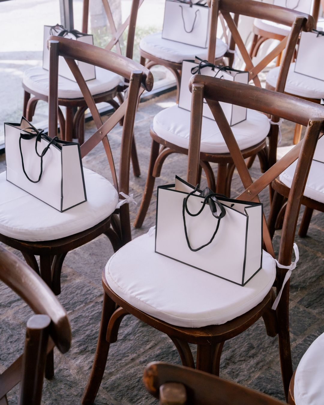Luxe goodie bags set out on seats for guests